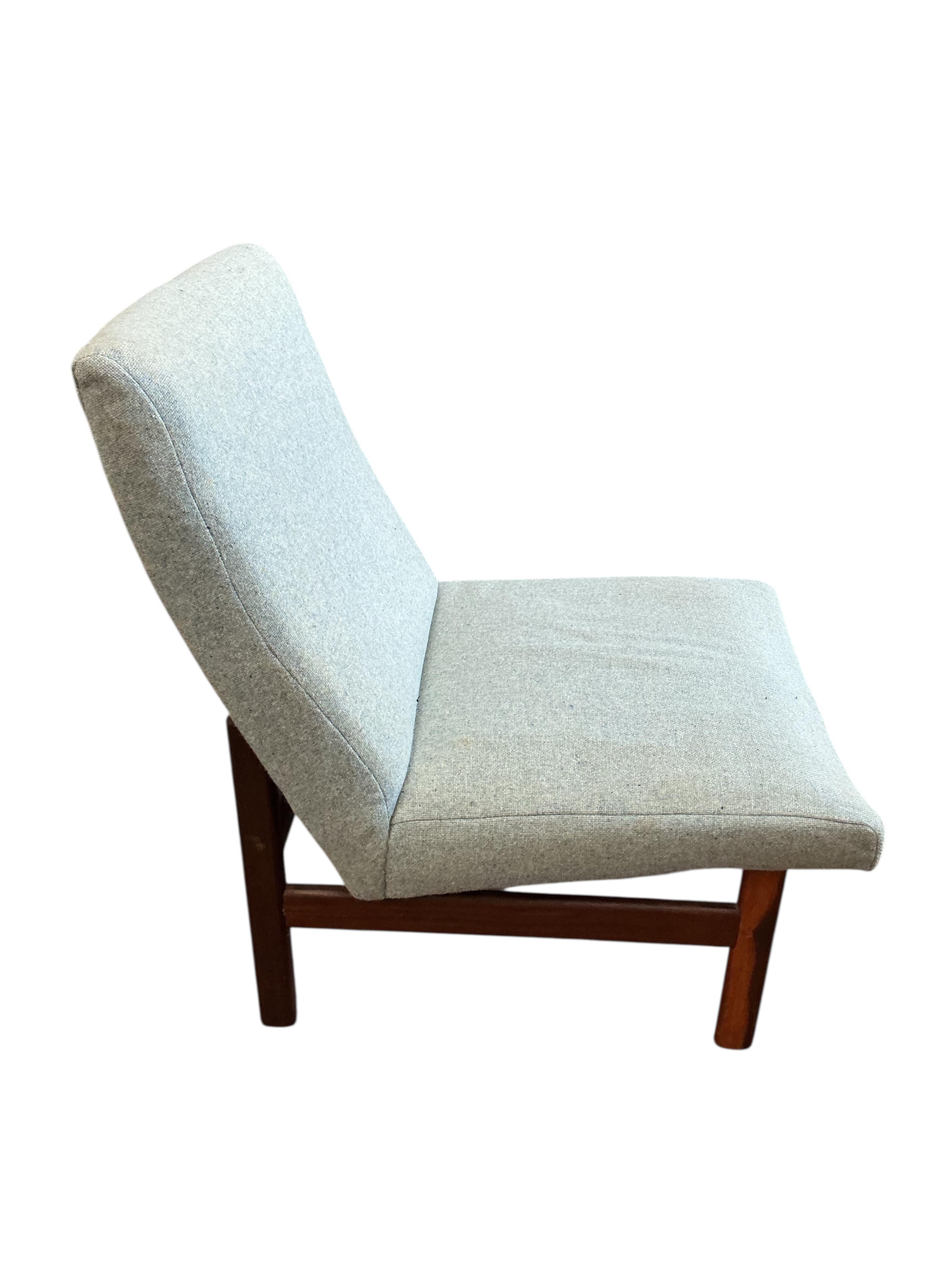 An Afromosia cocktail chair in a Danish style, width 55cm, depth 60cm, height 78cm